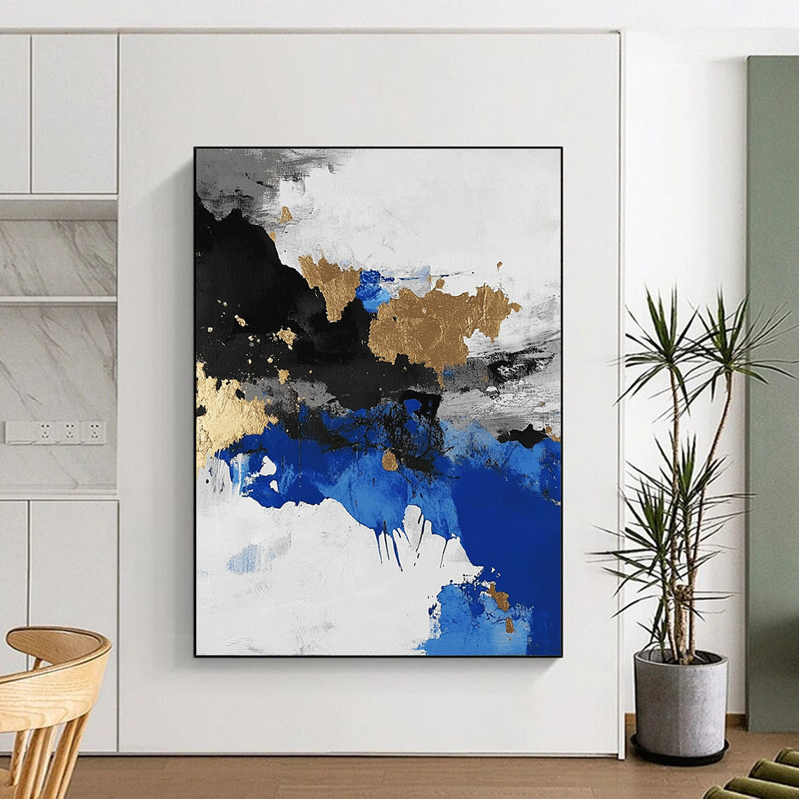 Contemporary abstract artwork showcasing an aerial view of an arctic landscape in black and white with blue accents and gold leaf highlights. DLZ0572