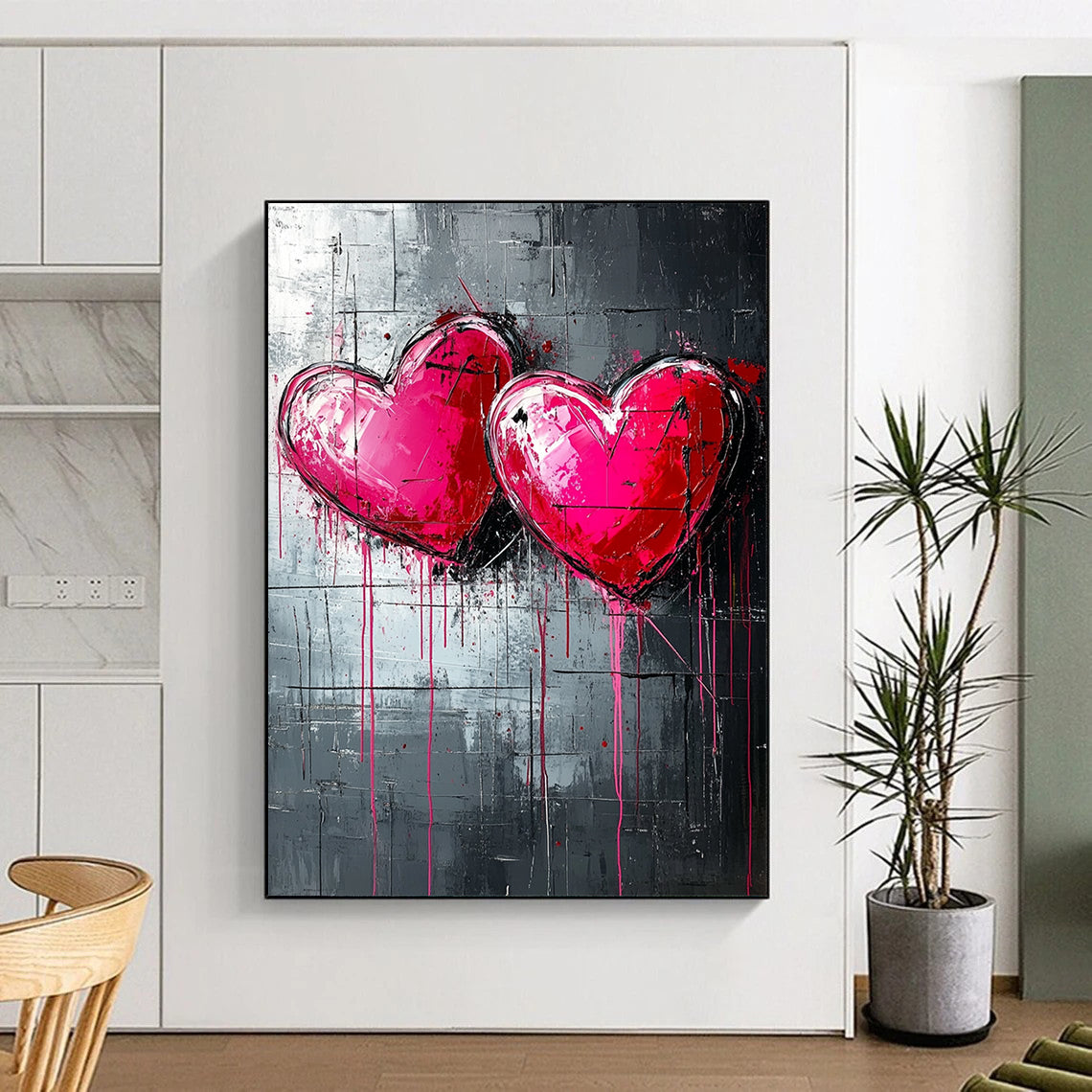 Bold contemporary abstract art featuring three pink and red hearts on a textured dark grey backdrop with dripping paint lines inspired by graffiti style. DLZ0263
