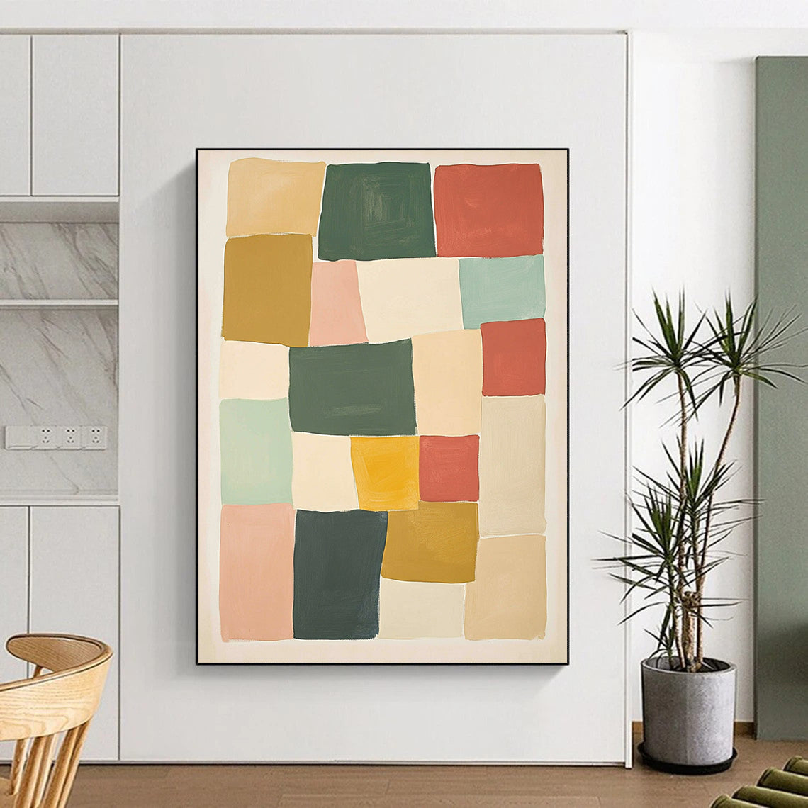Contemporary hand-painted abstract artwork features geometric blocks in shades of green red and yellow against a beige background creating a harmonious composition. DLZ1596