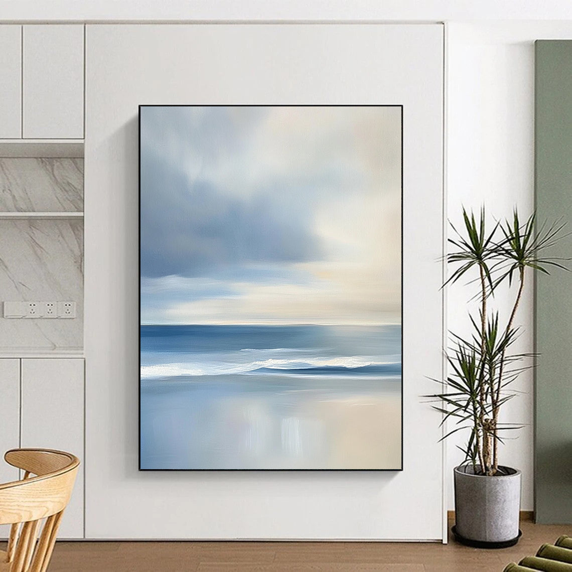 Contemporary abstract artwork features a serene ocean with gentle waves and soft clouds, showcasing light blues and grey tones for a tranquil ambiance. DLZ1460