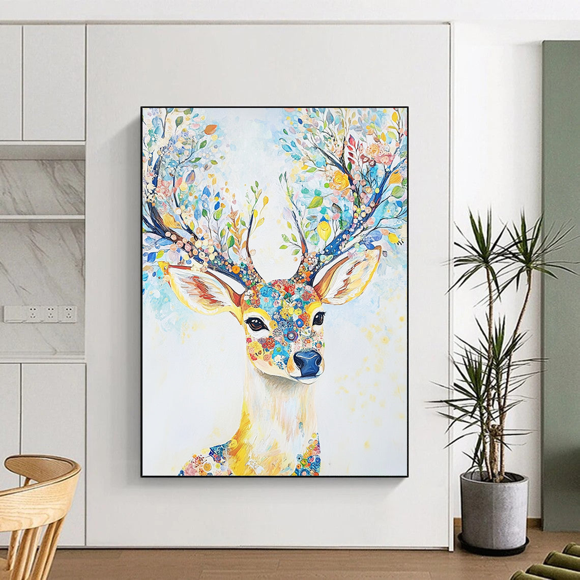 Abstract contemporary artwork features a majestic deer adorned with floral antlers in light blue and yellow tones set against a dreamy white canvas. DLZ1245