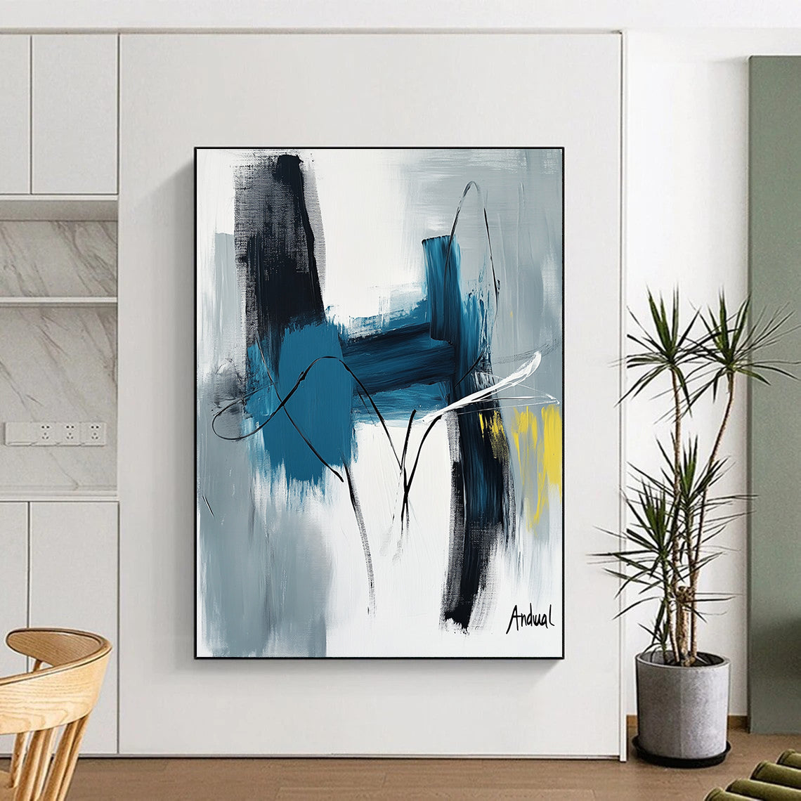 Contemporary abstract art showcasing "Andual" with bold strokes in blue and white on neutral canvas featuring black lines and hints of yellow or gray. DLZ0866