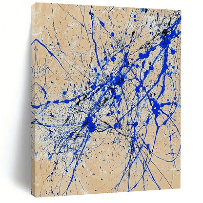 Contemporary abstract art features dynamic blue and white lines on beige paper in a vertical splatter style reminiscent of Jackson Pollock. DLZ0977