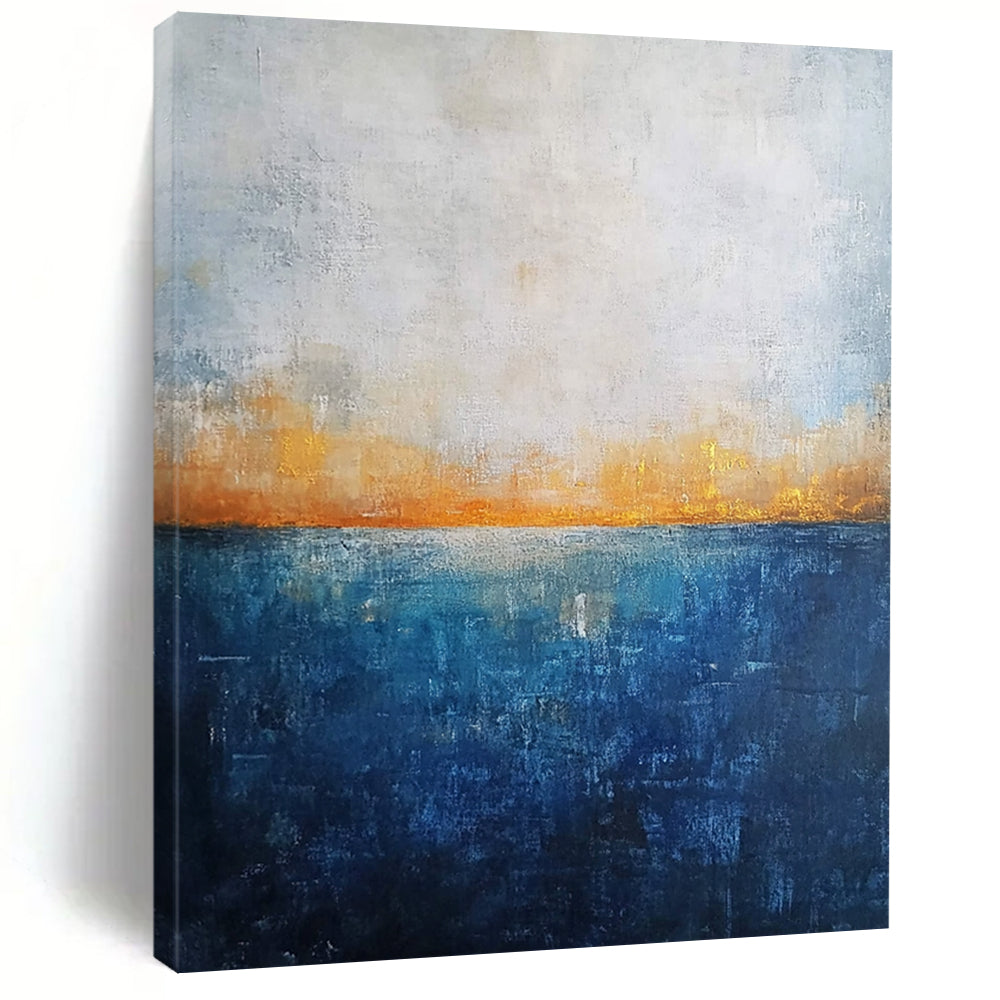 Contemporary abstract artwork featuring a deep blue ocean textured canvas with misty horizon neutral colors and elegant gold highlights. DLZ0468