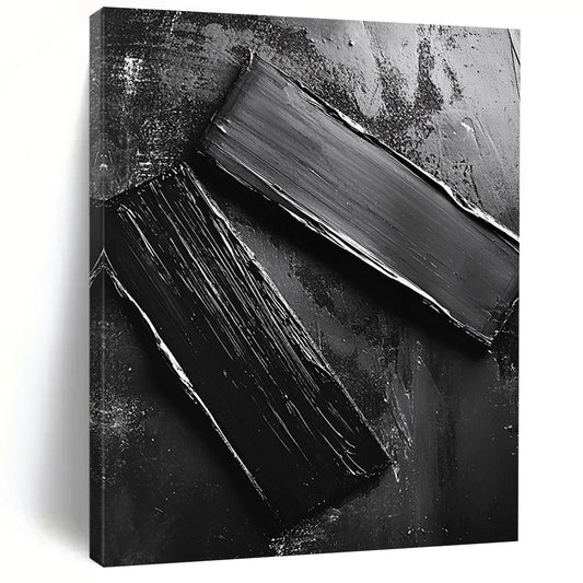 Abstract contemporary artwork featuring smooth black oil-painted metal pieces arranged on the ground reflecting mechanical elements and minimalist design. DLZ1551