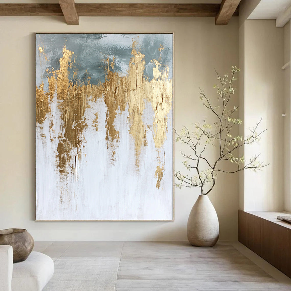 Contemporary hand-painted abstract artwork in white and gold featuring textured paint surface and elegant gold foil accents. DLZ0686