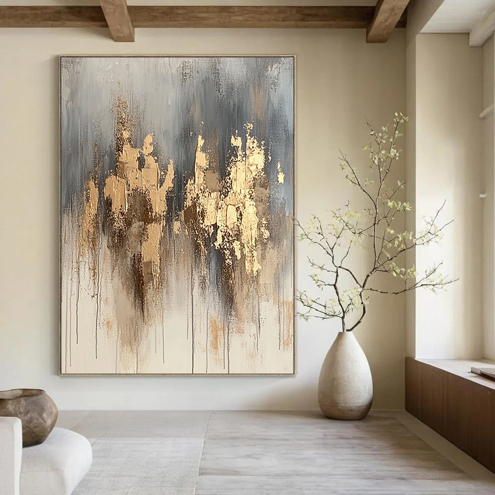 Contemporary hand-painted abstract artwork features neutral tones with gold accents and dynamic paint splashes for a refined aesthetic. DLZ1076