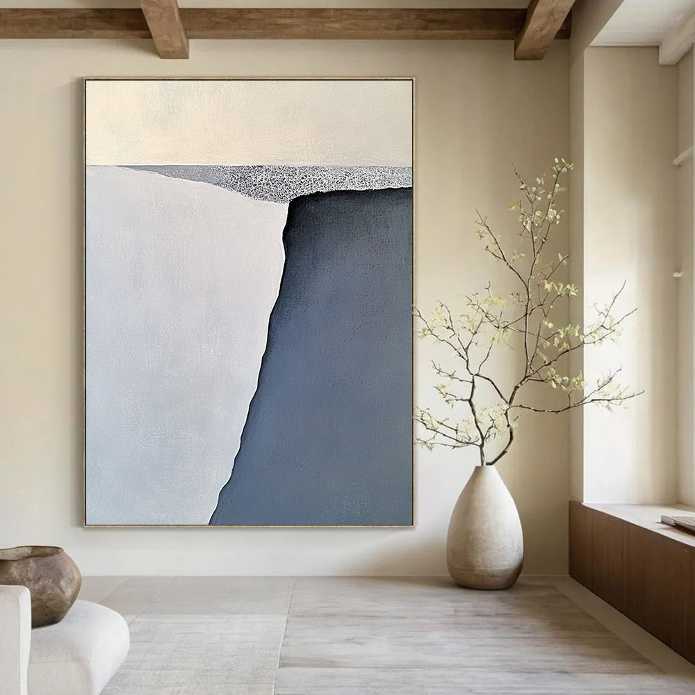 Contemporary large abstract painting features serene gray-blue and white iceberg forms with soft brushstrokes balanced on a flat gray base. DLZ1006