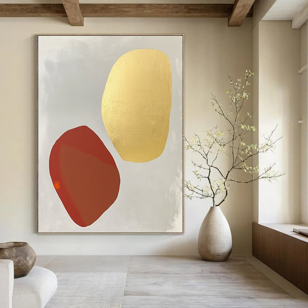 Contemporary abstract painting featuring white and gold shapes on light gray with organic forms and soft tones highlighted by pale red and orange accents. DLZ1735