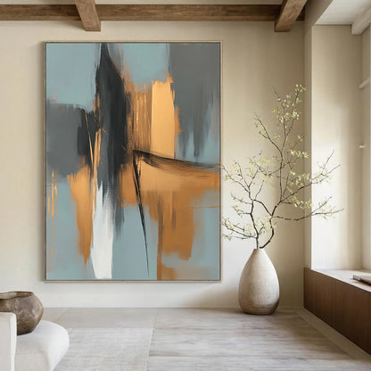 Large contemporary abstract painting features elegant gold and gray shapes against a light blue background evoking an urban landscape with serene organic forms. DLZ0706