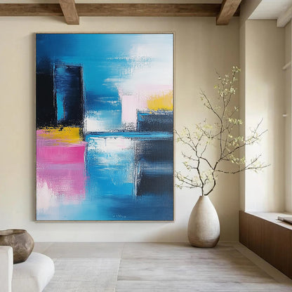 Modern abstract artwork features vibrant blue and pink brushstrokes, showcasing a contemporary cityscape against a soft sky and serene sea. DLZ0348
