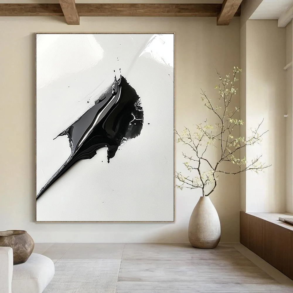 Contemporary abstract art featuring a black paint spread resembling a shark's fin on a white background capturing intricate details with a macro lens effect. DLZ1556