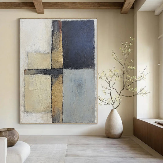Contemporary abstract painting featuring textured gray and blue squares with serene beige tones on canvas creating a calm and balanced atmosphere. DLZ0983