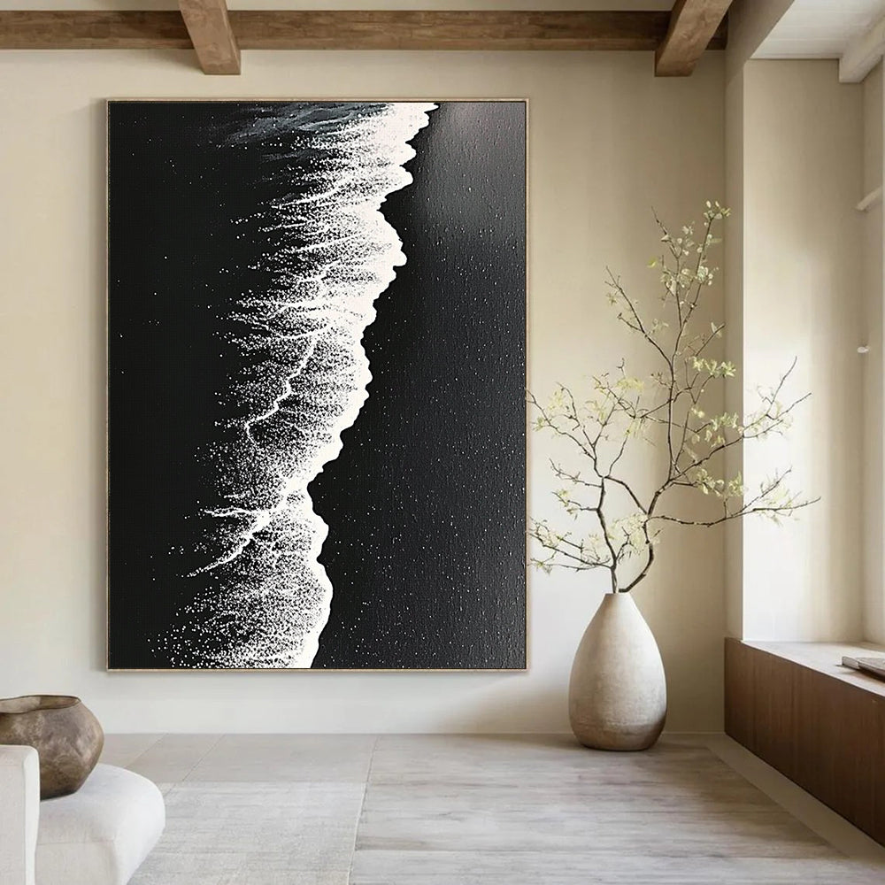 Contemporary abstract artwork capturing high-contrast monochrome beach waves on dark sand with intricate details and surrealistic perspective. DLZ0841