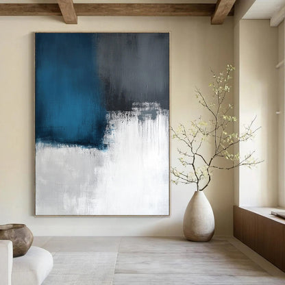 Contemporary large abstract artwork featuring layers of light sky-blue and dark gray, inspired by a calm sea on a white canvas. DLZ0539