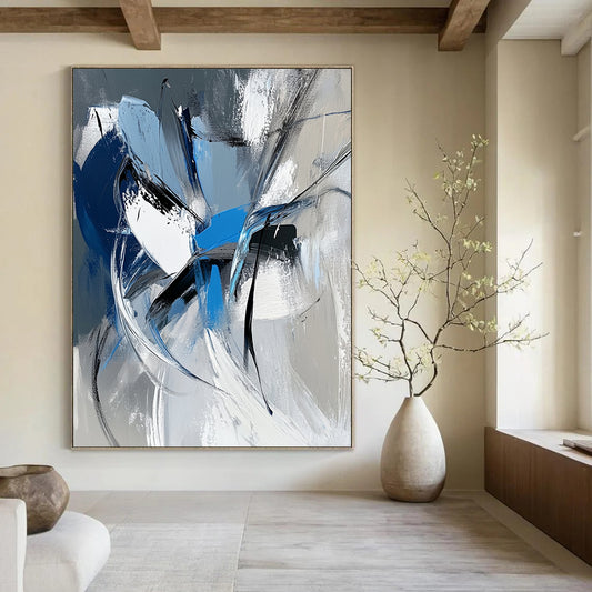 Large contemporary hand-painted abstract art featuring dynamic white gray and blue shapes with bold brushstrokes and a vibrant urban energy. DLZ1008