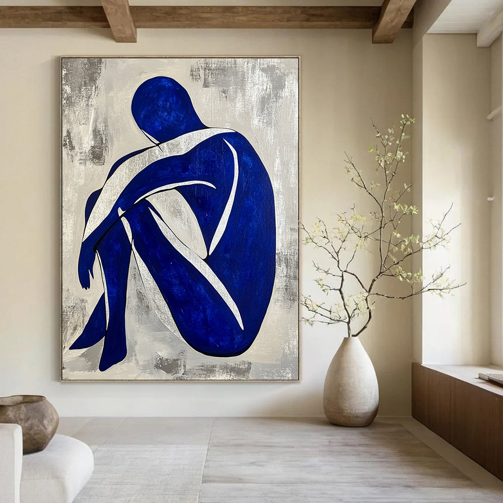 Contemporary hand-painted abstract artwork featuring a seated blue and white figure with a grey background and silver lines. DLZ0586
