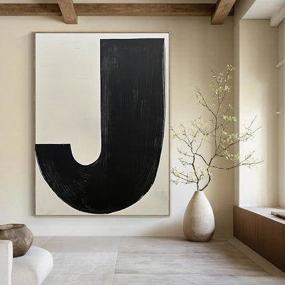 Contemporary hand-painted abstract art featuring bold black and white contrasts with a prominent beige J and a dark grey organic form. DLZ1342