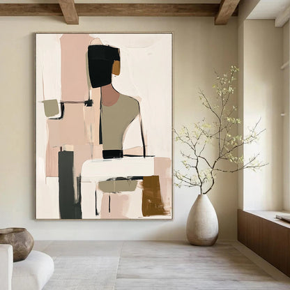 Contemporary handmade abstract art featuring muted beige black and white tones with soft pink and green hints and loose shapes around a visible table. DLZ0912