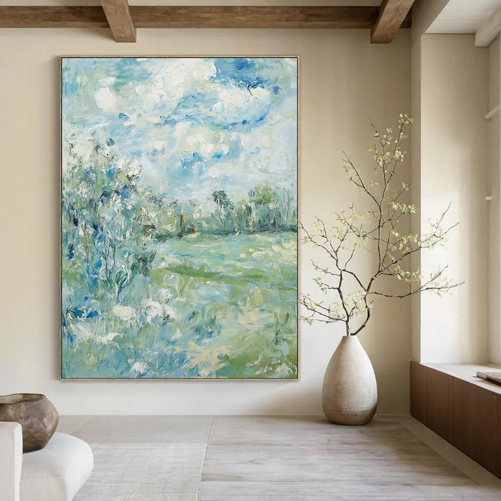 Contemporary hand-painted abstract art featuring soft clouds over serene trees and grass with a calming color palette of blue green and beige. DLZ1473