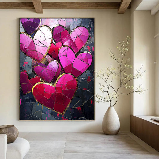 Contemporary abstract artwork features vibrant pink and red hearts with gold foil accents against a dark background illuminated by a mosaic of broken glass pieces. DLZ1721