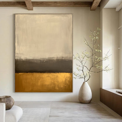 Large contemporary abstract painting featuring an off-white background and gold bottom with minimalist earth tones and low contrast for a serene aesthetic. DLZ1013