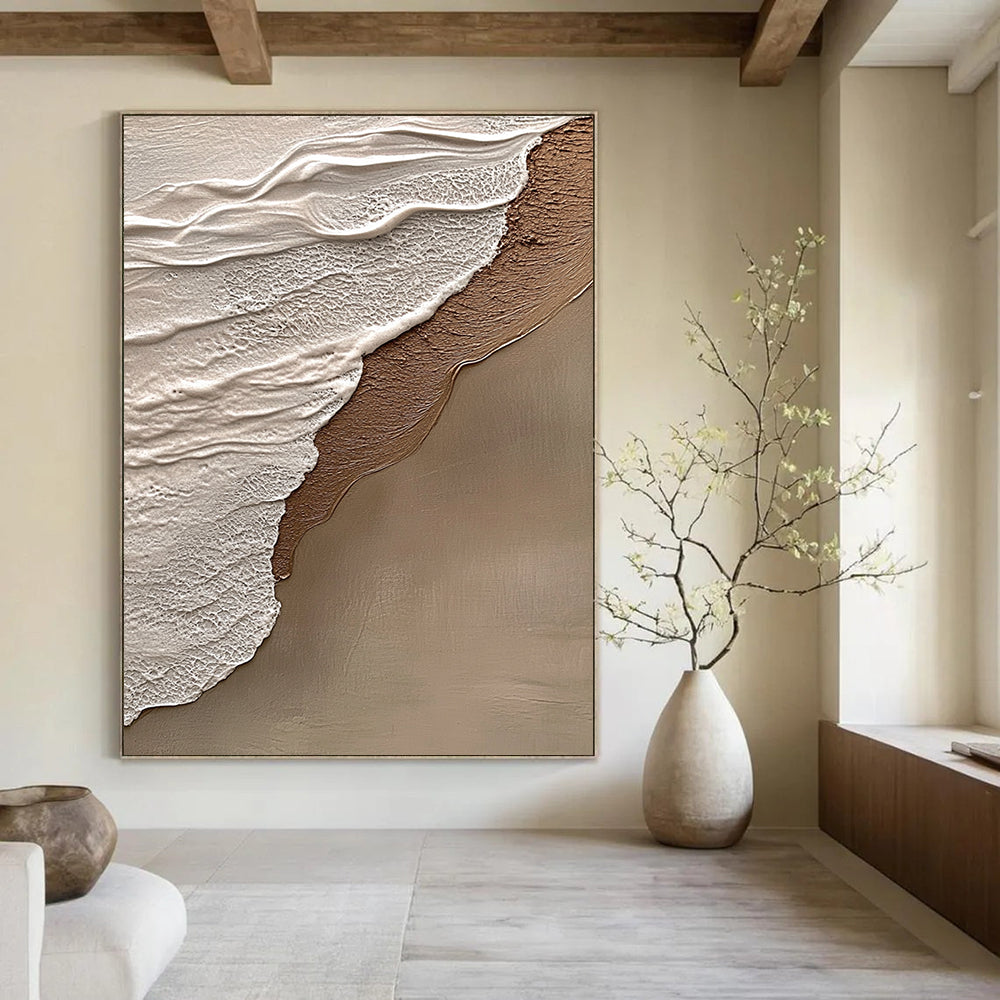 Contemporary hand-painted abstract art features beige and gray tones, evoking tranquility and harmony with a natural beach scene in the background. DLZ1212