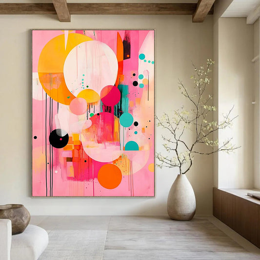 Contemporary abstract painting features large circles and colorful shapes on a pink background with black lines and orange accents in a joyful style. DLZ0763