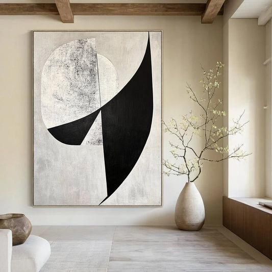 Contemporary abstract art features bold black and white shapes with diagonal cuts against a gray background and geometric figures adding depth. DLZ1400