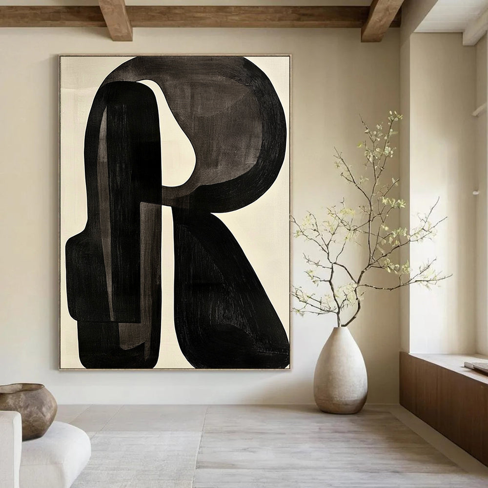 Contemporary abstract artwork featuring black and white shapes with a prominent letter R on a light gray background in the style of Jean Arp. DLZ0638