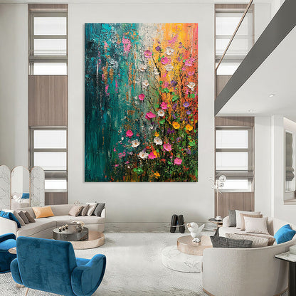 Contemporary abstract painting capturing spring's essence with vibrant flowers and trees in green blue pink and yellow accented by gold and silver textures. DLZ0644