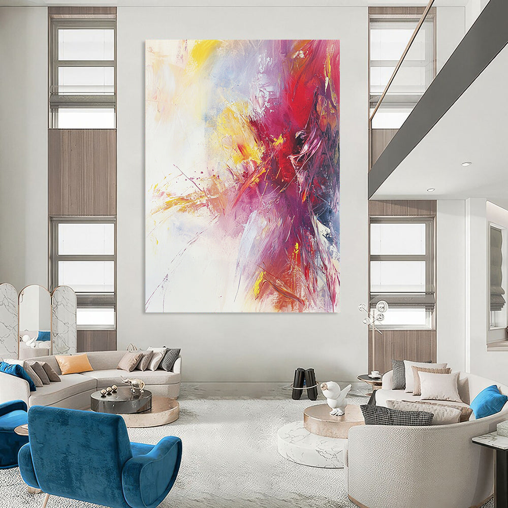 Large contemporary hand-painted abstract artwork featuring warm colors and soft brushstrokes on a serene white background with subtle splashes of bright color. DLZ1068