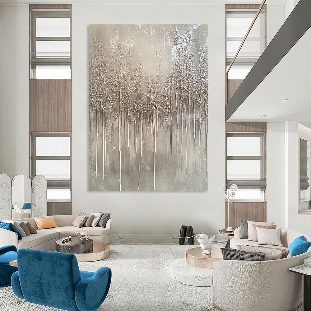 Large contemporary hand-painted abstract artwork featuring a monochromatic gray palette with drips and metallic silver accents evoking winter landscapes. DLZ1517
