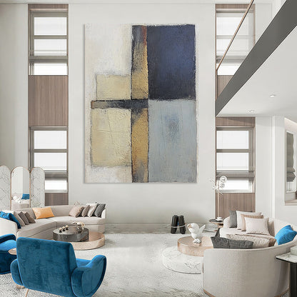 Contemporary abstract painting featuring textured gray and blue squares with serene beige tones on canvas creating a calm and balanced atmosphere. DLZ0983