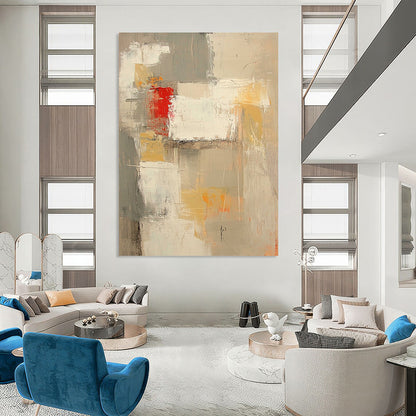 Contemporary abstract painting features neutral tones with red and yellow accents large brush strokes and textures in expansive white spaces. DLZ0921