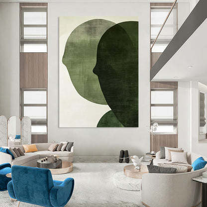 Contemporary abstract art features large forest green shapes on an off-white textured background, creating faces that symbolize connection and balance. DLZ1364