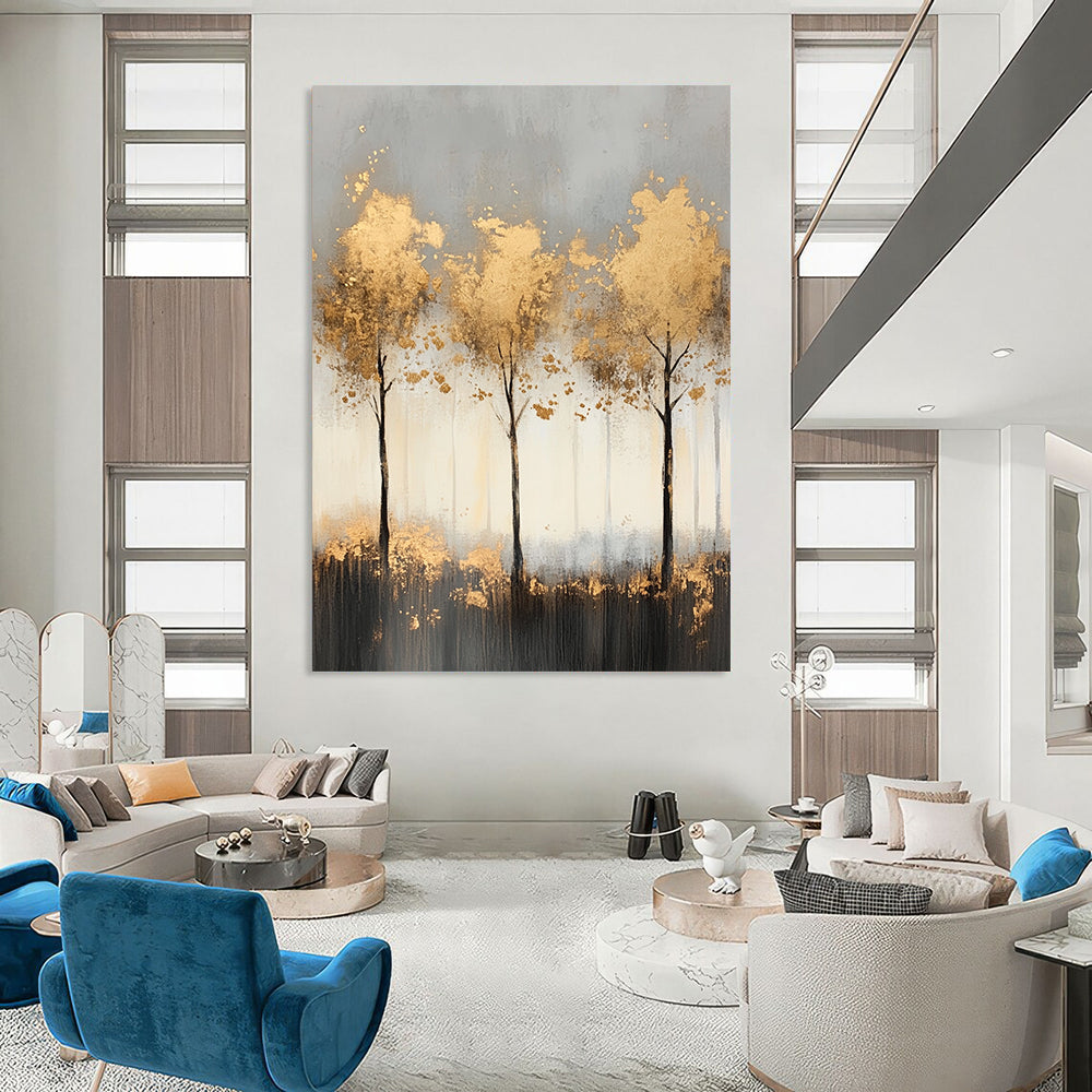 Contemporary abstract painting features misty landscape with light gray and gold tones, delicate tree shapes, and shimmering golden foil accents for a serene ambiance. DLZ1352