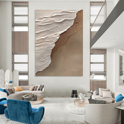 Contemporary hand-painted abstract art features beige and gray tones, evoking tranquility and harmony with a natural beach scene in the background. DLZ1212
