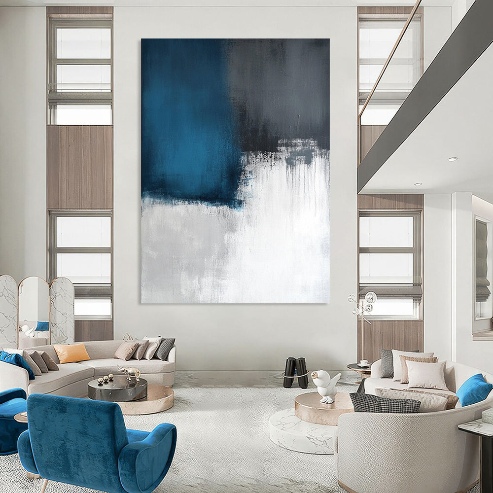 Contemporary large abstract artwork featuring layers of light sky-blue and dark gray, inspired by a calm sea on a white canvas. DLZ0539