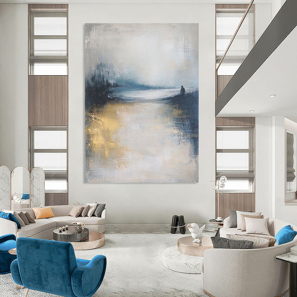 Contemporary abstract art featuring a moody ocean landscape in soft focus, neutral tones enhanced by gold and blue, creating a serene atmosphere. DLZ0464