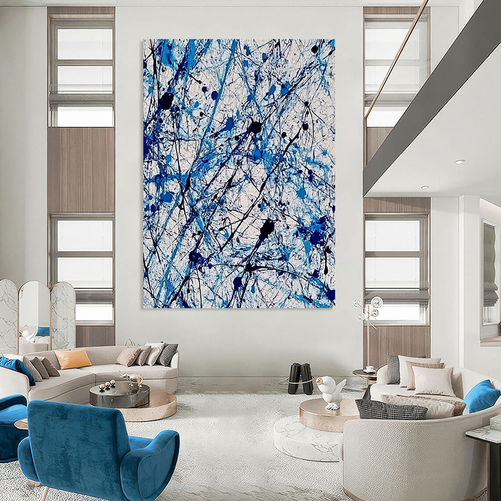 Contemporary abstract painting features vibrant blue and white ink splashes with lace-like patterns creating dynamic movement and evoking joy. DLZ1410