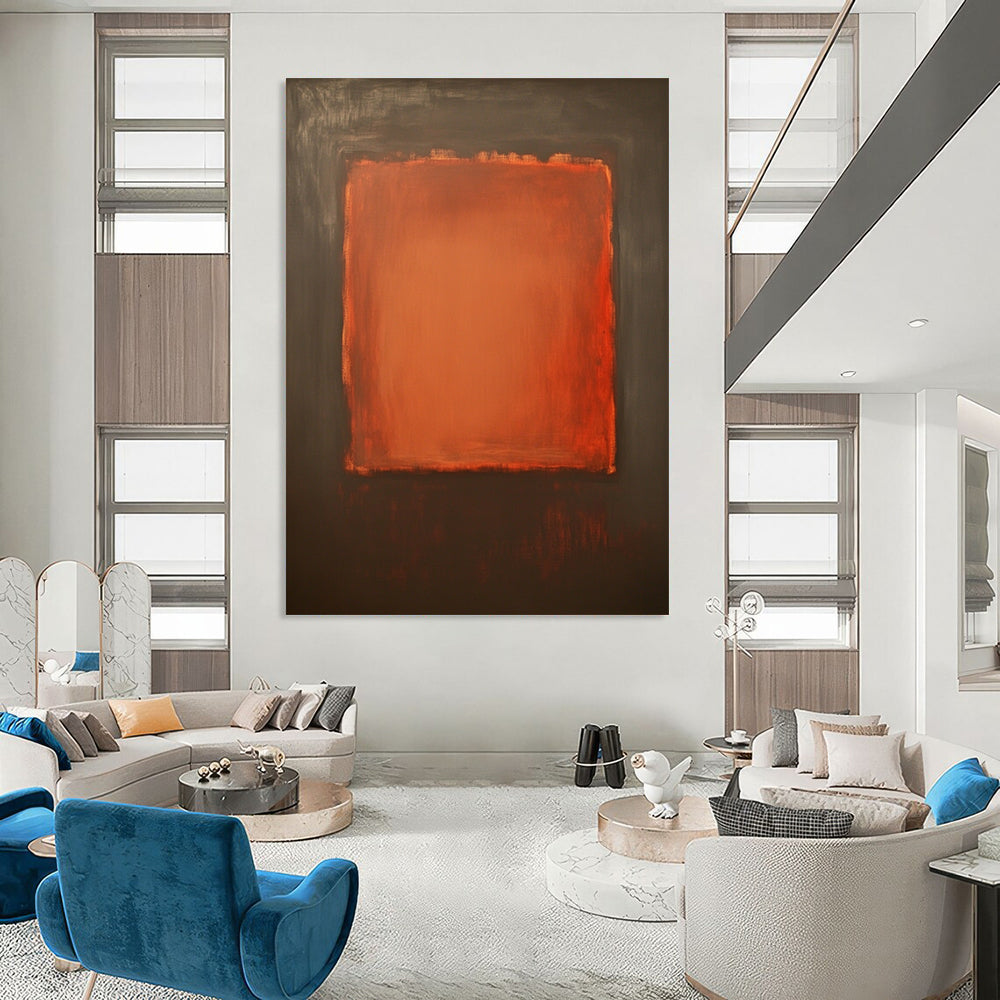 Contemporary hand-painted abstract art features a large burnt sienna canvas with a small textured orange square against a dark gray background. DLZ1380