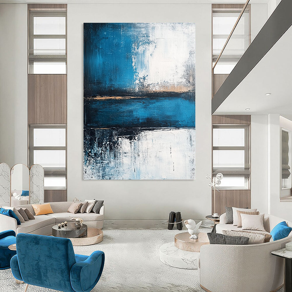 Contemporary abstract painting showcasing a serene blue sea with deep gray strokes and light white accents, evoking tranquility and strength. DLZ0360