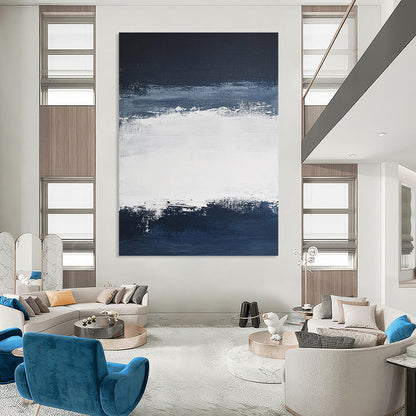 Large contemporary abstract painting featuring broad brush strokes in white and navy blue creating a tranquil atmosphere with a serene dark sky and soft gray clouds. DLZ0546
