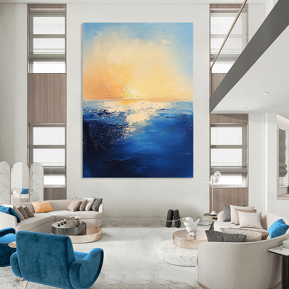 Contemporary abstract painting features textured navy ocean waves against a serene pastel sky and warm sun creating a mysterious atmosphere. DLZ0366