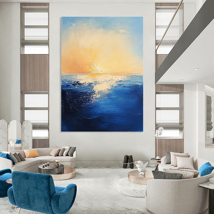 Contemporary abstract painting features textured navy ocean waves against a serene pastel sky and warm sun creating a mysterious atmosphere. DLZ0366