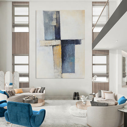 Contemporary abstract artwork showcasing a cross with soft shapes in earthy tones and blue-gray, featuring a vertical line and scattered blocks. DLZ0969