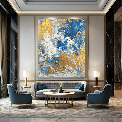 Large contemporary abstract painting featuring a textured blend of blue gold beige white and silver colors. Perfect for modern decor. DLZ0339