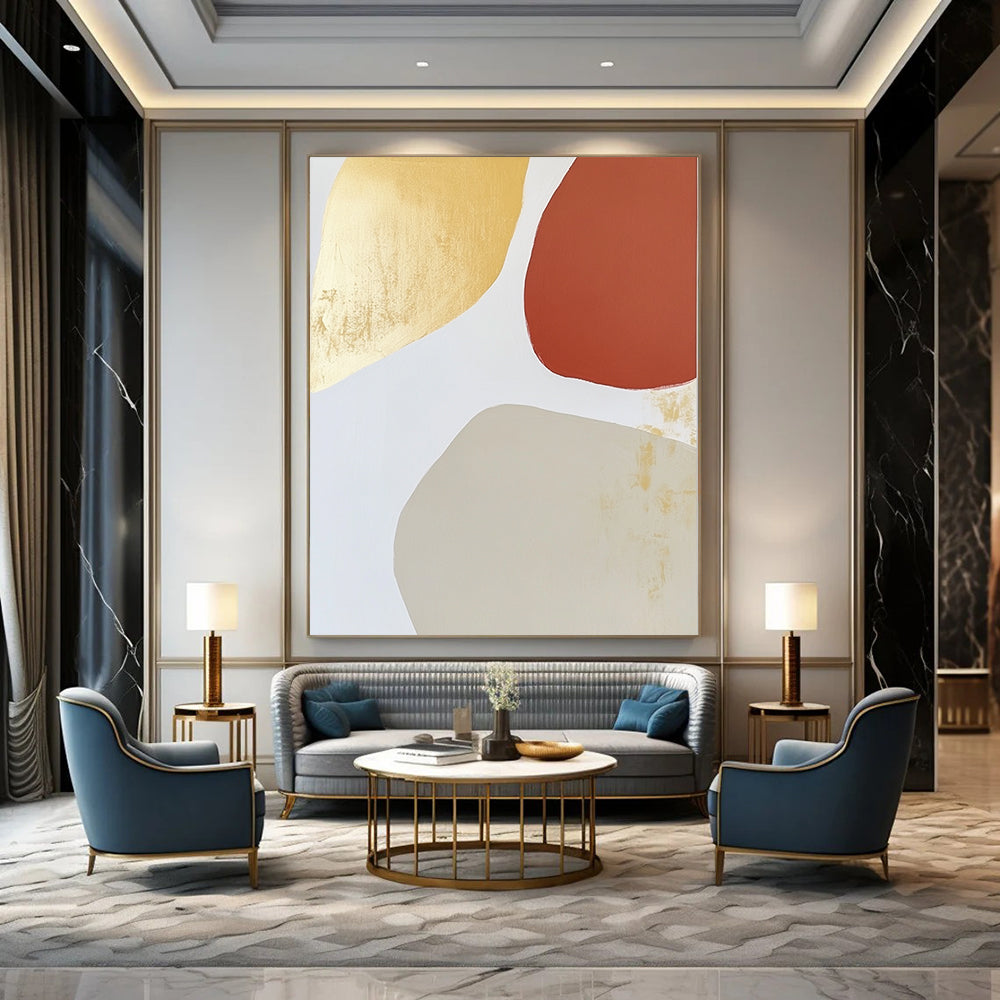 Contemporary abstract art features warm tones with an irregular oval shape, minimalist brushstrokes, and gold leafing on a light gray background. DLZ1518