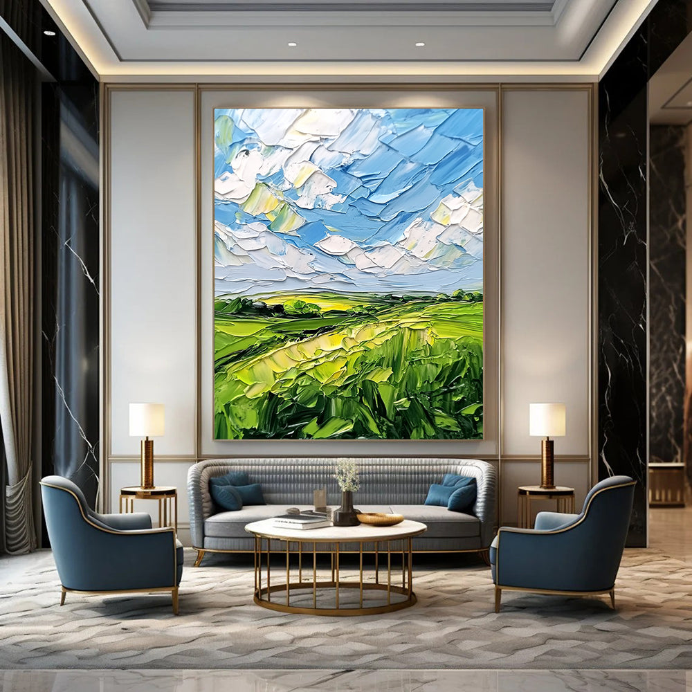 Contemporary abstract artwork featuring lush green fields and a vibrant blue sky with clouds, textured with bold impasto strokes. DLZ0484